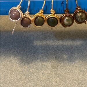 Three pairs of handmade earrings in silver gold and antique bronze